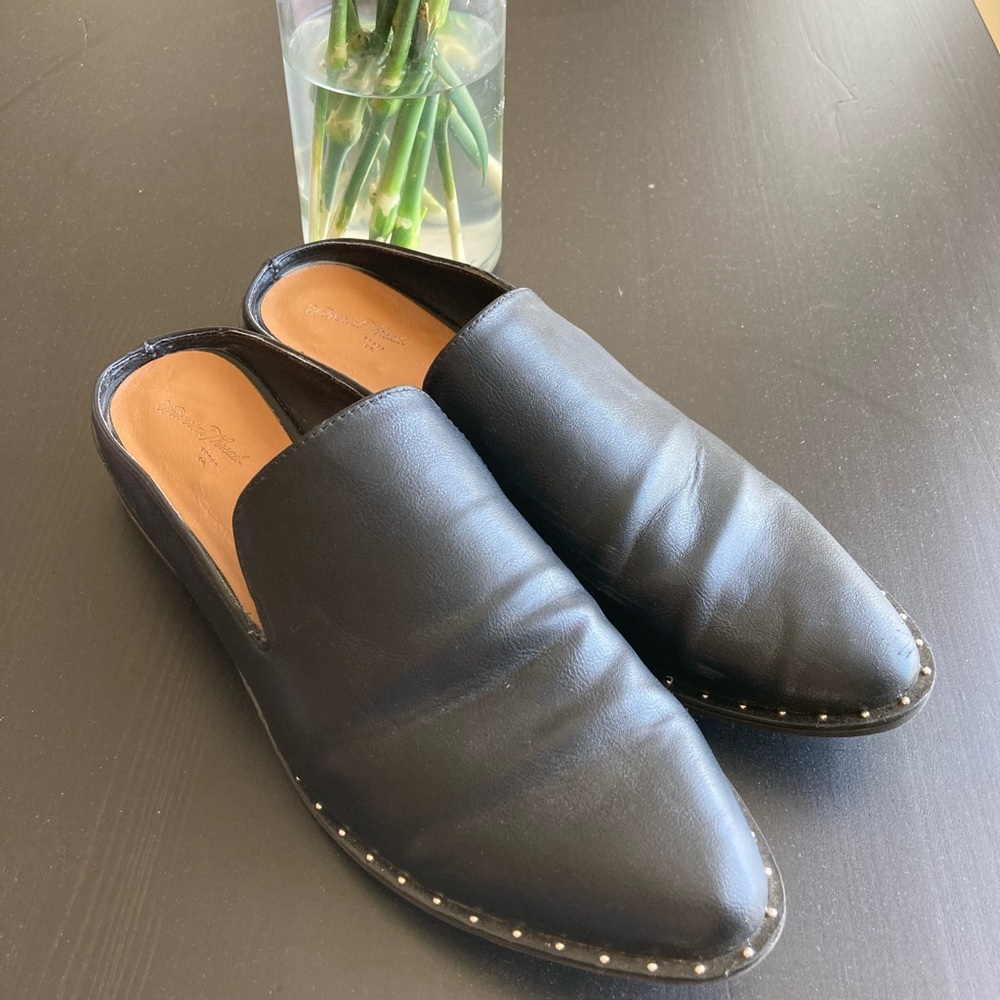 Studded black open back loafers